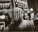  ?? John Locher / Associated Press ?? Trump supporters protest the vote Wednesday outside the Clark County Election Department in Las Vegas.