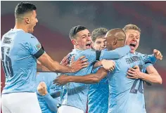  ??  ?? City celebrate Fernadinho’s clinching goal.