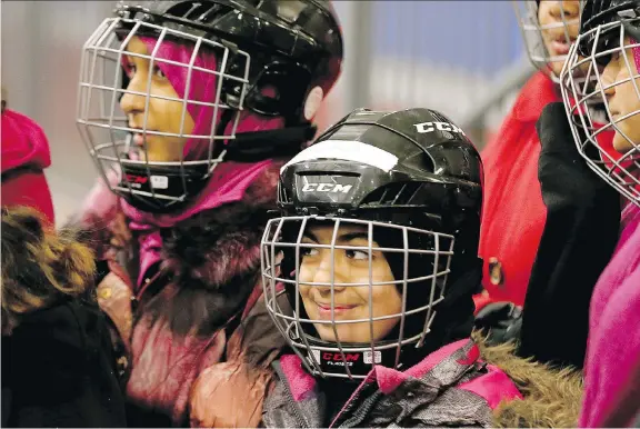  ?? WAYNE CUDDINGTON ?? Kids from two local public schools were all smiles when they hit the ice at Jim Durrell Arena last month to learn how to skate. While many new Canadians have begun learning about hockey, Hockey Canada has recognized it needs to do more as families turn away due to concerns over injuries, cost and because kids are playing video games.