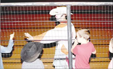  ??  ?? Rodeo clown Ty “Storming Norman” Stewart, of Washington, Kan., interacts with young children. The Profession­al Bull Riders Touring Pro Division comes to the Ogden Ranch, 11471 Illinois Chapel Road, Prairie Grove (same spot as Luke Bryan’s Farm Tour in 2016), July 17-18, from 8 p.m. to midnight nightly followed by musical guests. Gates open at 6 p.m. The two-day event originally scheduled at Parsons Stadium in Springdale has been moved due to covid-19 concerns. Drive-in viewing of the PBR events will be available to practice social distancing.