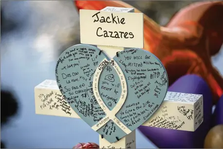  ?? DARIO LOPEZ-MILLS/ASSOCIATED PRESS ?? A cross dedicated to Jacklyn Cazares stands at a memorial site May 27 for victims killed in a shooting at Robb Elementary in Uvalde, Texas, on May 24. Jacklyn, 9, was among the 19 children and two teachers killed.