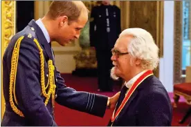  ??  ?? PROUD DAY: Billy is knighted by Prince William at Buckingham Palace