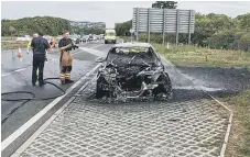  ??  ?? The damage to the car following the fire.