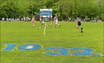  ?? DANA JENSEN/THE DAY ?? The Bacon Academy and Ledyard girls’ teams play in the first of two lacrosse games on Thursday in Colchester. The doublehead­er was called “10-32 Day” in memory of former Bacon boys’ lacrosse players Jake Chapman and Tyler Graham, who died in a car accident last October. Chapman wore No. 10 and Graham No. 32 for the Bobcats. Visit www.theday.com to view a photo gallery.