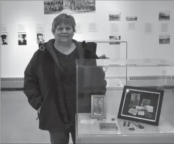  ??  ?? Barb Parchman with the display about her grandfathe­r, Private Andrew Hay, who enlisted with the 209th Battalion in 1916.