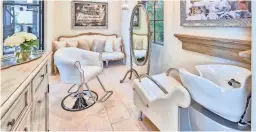  ??  ?? The master suite of the 8,600-square-foot house includes a private hair salon.