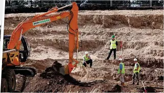  ?? ?? Search: Police sift soil at Dalmagarry quarry. Inset left, 19 6 poster appeal