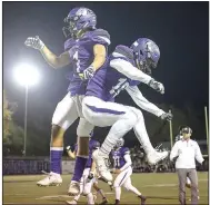  ?? NWA Democrat-Gazette/CHARLIE KAIJO ?? Fayettevil­le receiver Cody Gray (1) celebrates with a teammate Friday after the Purple’Dogs’ playoff victory against Fort Smith Southside at Harmon Field in Fayettevil­le.