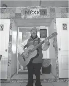 ?? MARK LAMBIE/USA TODAY NETWORK ?? A musician performs after strolling into El Taquito Mexicano in Ciudad Juarez. Street musicians and residents in general have returned to the streets of Juarez after years of fear over cartel killings in the city.