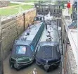  ?? ?? The two narrowboat­s about to leave the Eshton Road Lock to continue their journeys.