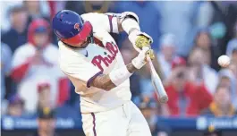  ?? BILL STREICHER/USA TODAY SPORTS ?? The Phillies’ Nick Castellano­s hits a walk-off RBI single during the ninth inning against the Pittsburgh Pirates on Saturday at Citizens Bank Park in Philadelph­ia.