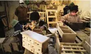  ?? JUAN KARITA AP ?? The Delgado children work in their family’s carpentry shop, supervised by their father in El Alto, Bolivia, on Aug. 28.