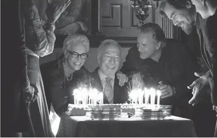  ?? PHOTOS BY CLAIRE FOLGER ?? Wealthy mystery writer Harlan Thrombey ( Christophe­r Plummer, center) celebrates his birthday with family members ( Jamie Lee Curtis, Don Johnson and Michael Shannon) before turning up dead in “Knives Out.”