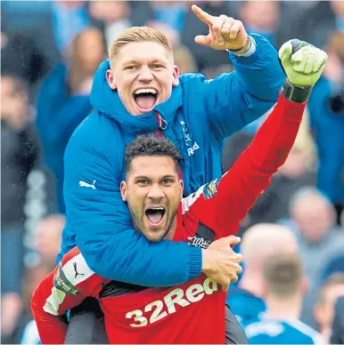  ??  ?? Wes Foderingha­m and Martyn Waghorn celebrate Rangers’ penalty shoot-out win over Celtic in the 2016 Scottish Cup semi-final