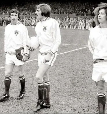  ??  ?? October 30, 1974 - the day of Mick Wallace’s first internatio­nal, as team captain Johnny Giles, Steve Heighway and debutant Liam Brady prepare to take on the Soviet Union in a heaving Dalymount Park.