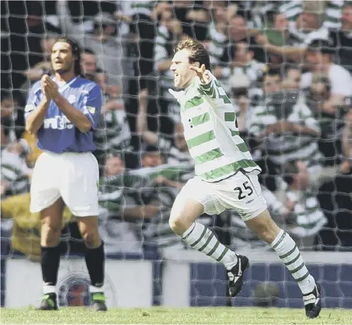  ??  ?? 0 Lubomir Moravcik takes the acclaim after netting against Rangers. Moravcik says the January 2 Old Firm derby is crucial for Celtic.