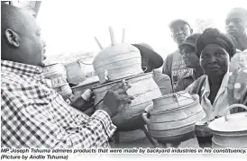  ??  ?? MP Joseph Tshuma admires products that were made by backyard industries in his constituen­cy. (Picture by Andile Tshuma)