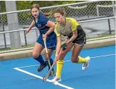  ?? WARWICK SMITH/STUFF ?? Feilding’s Jaya Lincoln, far right, rounds past Maddy Krebs of Massey during their game at Massey University last Saturday.