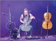  ?? STAN HUDY — SHUDY@DIGITALFIR­STMEDIA.COM ?? Yes, The Piano Guys is more than just a piano as Steven Sharp Nelson sits among his three cellos, plays percussion on one and uses the kick base to his right during Tuesday night’s performanc­e at Saratoga Performing Arts Center.