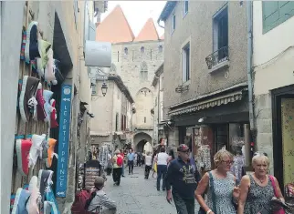  ?? PHOTOS: ALINA HARTOUNIAN/THE ASSOCIATED PRESS ?? History meets tourist shops in the city of Carcassonn­e.