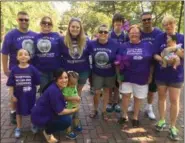  ?? MORNING JOURNAL FILE ?? The Billie Jeans, a team at the Oberlin Walk to End Alzheimer’s, pose for a group photo after the one-mile walk on Sept. 23, 2017, at Tappan Square in Oberlin. The event to raise money and awareness had at least 1,000 registered walkers and raised...