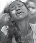  ?? The Associated Press ?? A relative grieves during the funeral of Alirio Duran, 25, at the Municipal Cemetery of Valencia, Venezuela, Friday.