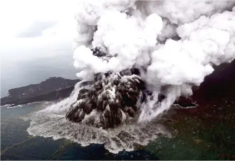  ??  ?? An aerial view of Anak Krakatau volcano during an eruption. — Reuters photo