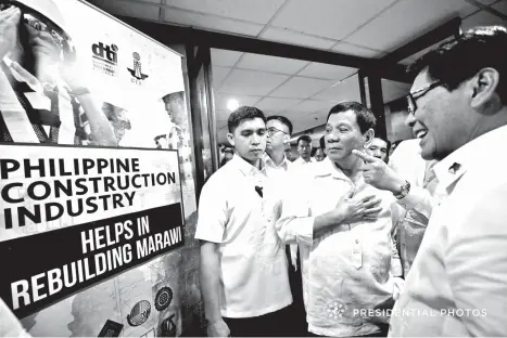  ?? PRESIDENTI­AL PHOTO ?? PRESIDENT RODRIGO Roa Duterte is welcomed by Labor and Employment Secretary Silvestre Bello III to the 2nd Philippine Constructi­on Congress at the Philippine Internatio­nal Convention Center in Pasay City on November 28, 2017. The President was only...