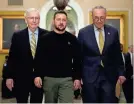  ?? DREW ANGERER/GETTY IMAGES ?? Mitch McConnell and Charles Schumer flank Ukrainian President Volodymyr Zelenskyy at the U.S. Capitol on Dec. 12.