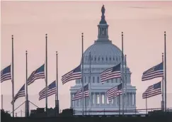  ??  ?? Flags were at half mast in Washington out of respect
