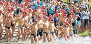  ?? Picture: MATTHEW BOON ?? WADING RIGHT IN: Swimmers in last year’s Merrifield Mile enter the water. This year’s Merrifield Mile takes place on March 4