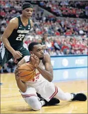  ?? Paul Vernon Associated Press ?? OHIO STATE forward Keita Bates-Diop grabs the ball in front of Michigan State guard Miles Bridges.