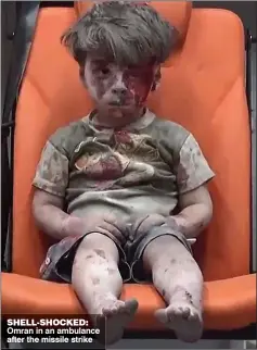  ??  ?? SHELL-SHOCKED: Omran in an ambulance after the missile strike