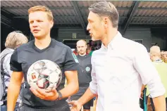  ??  ?? Bayern Munich coach Niko Kovac (right) speaks with referee Thorben Siewer before a German Cup DFB Pokal match. — Reuters photo