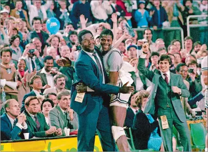  ?? AP FILE PHOTO ?? In this April 2, 1984, photo, Georgetown head coach John Thompson, left, gives a happy pat to Most Valuable Player Patrick Ewing after Georgetown defeated Houston 84-75 for the national championsh­ip in Seattle. Thompson, the imposing Hall of Famer who turned Georgetown into a “Hoya Paranoia” powerhouse and became the first Black coach to lead a team to the NCAA men’s basketball championsh­ip, died at the age of 78. His death was announced in a family statement Monday. No further details were disclosed.