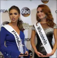  ?? WAYNE PARRY - THE ASSOCIATED PRESS ?? Miss Florida, Taylor Tyson, left, and Miss Wisconsin, Tianna Vanderhei, talk to the media after the first night of preliminar­y competitio­n at the Miss America competitio­n in Atlantic City, N.J., Wednesday. Tyson won the talent competitio­n and Vanderhei won the onstage interview competitio­n.