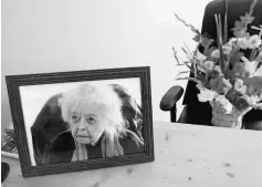  ??  ?? A portrait of Dupree and a bouquet of flowers are seen in her office after she passed away, in Afghanista­n Centre at Kabul University (ACKU), in Kabul. — Reuters photo