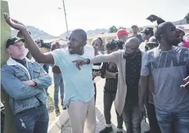  ??  ?? ENRAGED. Residents outside the Ga-Rankuwa Arts and Crafts Centre that Solly Msimanga and Mmusi Maimane visited.