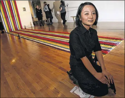  ?? FILE PHOTO ?? Marietta artist Gyun Hur, who one last year’s Hudgens Prize for her installati­on “She Prays Happiness” has been appointed to the advisory committee that will guide the competiton.