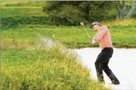  ?? HARRY HOW / GETTY IMAGES ?? Adam Scott hit from a bunker during the U.S. Open at Pebble Beach Golf Links on June 15, in California. After top-eight results at the recent PGA Championsh­ip and U.S. Open, he aims to add an elusive second major title to his 2013 Masters.