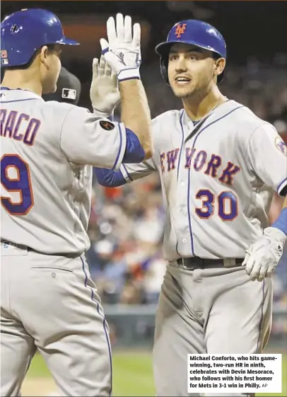  ?? AP ?? Michael Conforto, who hits gamewinnin­g, two-run HR in ninth, celebrates with Devin Mesoraco, who follows with his first homer for Mets in 3-1 win in Philly.