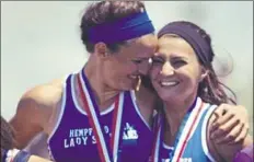  ?? Photo submitted ?? Maddie Holmberg, left, and Bridget Guy were on a state championsh­ip relay team at Hempfield High in 2014 and helped the Spartans win the team championsh­ip that year.
