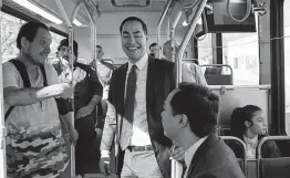  ?? Lisa Krantz / Staff photograph­er ?? Julián Castro, center, his twin brother, Joaquín, and daughter, Carina, 9, ride the bus to Guadalupe Plaza on the same route they rode as kids to middle school.