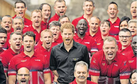  ??  ?? Prince Harry with athletes at the launch of the UK’S Invictus Games team at the Tower of London yesterday. Left, Maya Turner and the letter she read out