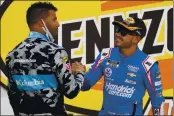  ?? JOHN LOCHER — THE ASSOCIATED PRESS ?? Bubba Wallace, left, congratula­tes Kyle Larson after Larson won a NASCAR Cup Series race Sunday in Las Vegas.