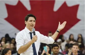  ?? NATHAN DENETTE/THE CANADIAN PRESS ?? Prime Minister Justin Trudeau answers questions from the public during his town hall meeting in Hamilton.