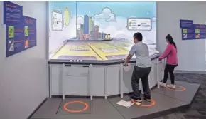  ??  ?? Kids can “run” a virtual city by literally running in place.