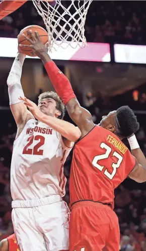  ??  ?? Maryland forward Bruno Fernando blocks a shot by Wisconsin's Ethan Happ on Sunday in College Park, Md.