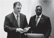  ?? Photos by Shaban Athuman / Dallas Morning News ?? Dallas Mayor Mike Rawlings, left, temporaril­y halted a City Council meeting Wednesday after protesters chanted “no justice, no peace.”