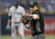  ?? CHRIS O’MEARA — THE ASSOCIATED PRESS ?? Home plate umpire Chris Guccione points to Tampa Bay Rays’ Kevin Kiermaier during the first inning of a baseball game Saturday in St. Petersburg, Fla.